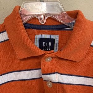 GAP kids orange rugby style shirt with blue and white stripes.  Size Small (6-7)